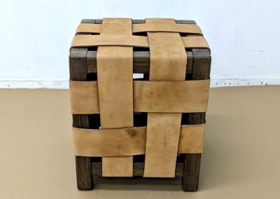 Teak stool with leather weave.