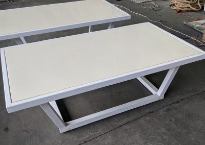 Outdoor coffee table - Powder coated Textured white aluminum tube , composite stone top with marine plywood backing.